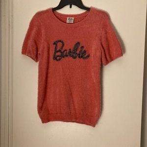 Barbie short sleeve sweater. Sparkly black and silver stitched on letters